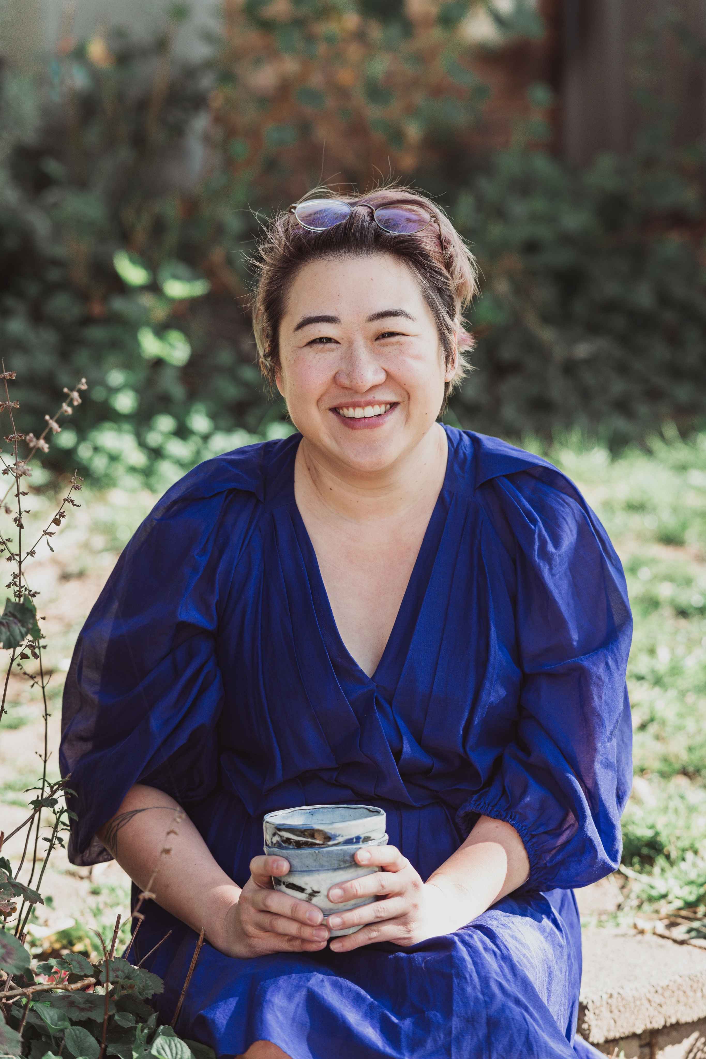 Portrait photo of Jacqui Rae in a nature background